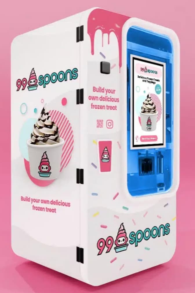 FroYoRobo 99 Spoons machine with a cup of vanilla soft serve