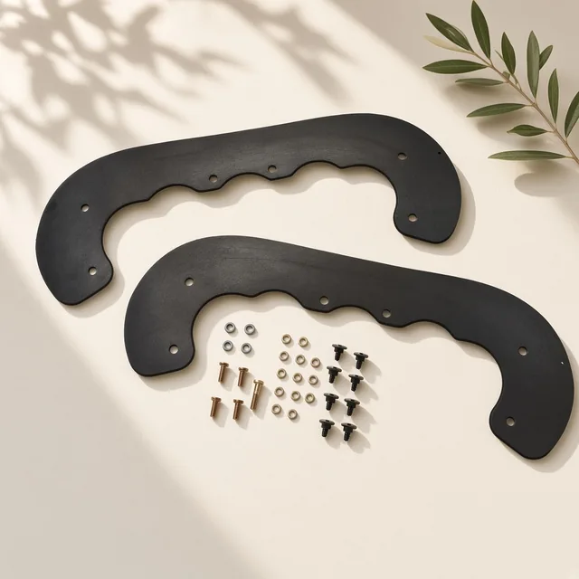 Illustration of two curved black rubber snow blower paddles with mounting hardware